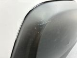 a close up of a car ' s rear bumper with scratches on it