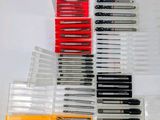 a lot of pens that are sitting on a table