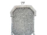 a silver purse with pearls and pearls hanging from it