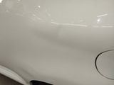 a close up of a car ' s front bumper and fender