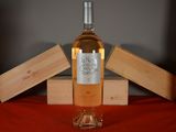 a bottle of wine that is sitting on a table