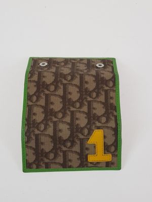 brown and green bifold wallet with number 1 on it