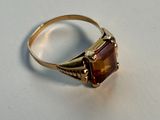 yellow gold ring with a square cut garnetite stone
