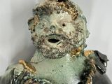 a statue of a man with a beard and a beardless face