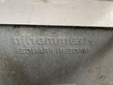 a close up of a metal box with a sign on it