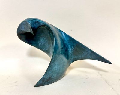 sculpture of a blue bird on a white background