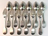 a lot of silver spoons and forks on the table