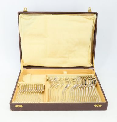 a brown case with silverware in it on a white surface