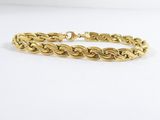 an image of a gold bracelet on a white background