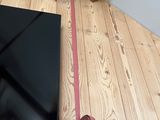 a laptop on the floor with a leash attached to it