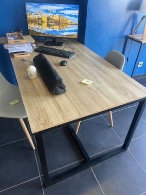 a desk with a computer, keyboard, mouse and mouse on it