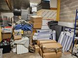 a pile of boxes and boxes on the floor in a room