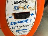 a close up of an orange electric device on a table