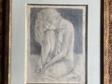 framed drawing of a nude woman sitting on her knees on a brown carpet