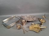 an assortment of silverware including a tray, tray, spoon, and other items
