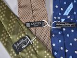 three ties with a label on them sitting next to each other
