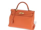 a brown leather handbag on a white background