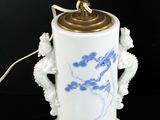 a lamp that has a blue and white design on it