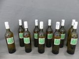 bottles of olive oil are lined up in a row on a table