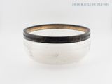 an image of a white bowl with black rim sitting on a white surface