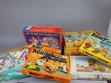 several children ' s board games sitting on top of a table