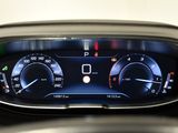 a close up of a car dashboard with a clock on it