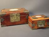 two wooden boxes that are sitting next to each other
