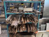 a lot of metal items on a shelf in a warehouse