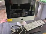 a computer on a desk with a keyboard and mouse