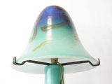 a lamp that is sitting on a stand on a table
