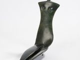 sculpture of a female torso on a stand on a white background