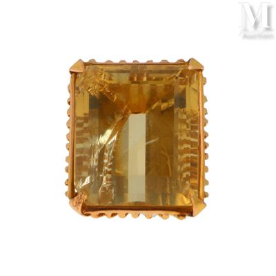 an image of a fancy gold ring with a large square cut stone