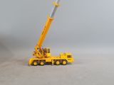 a toy truck with a crane on top of it