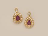 a pair of ruby and diamond earrings
