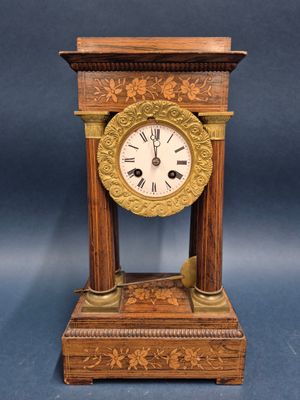 a small clock that is sitting on a table