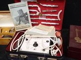 a suitcase that has some items in it on a table