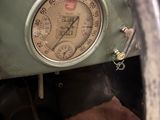 a close up of a gauge in a car ' s dashboard