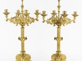 a pair of gold plated candelabs with four arms