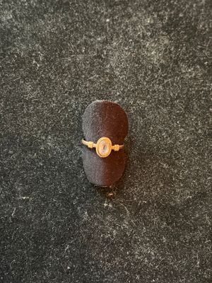 an image of a ring with a gold ring on it