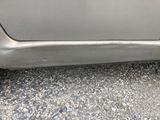 a close up of a car ' s door handle on the side of the car