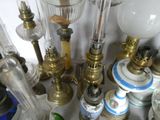 many different types of glass lamps on the table