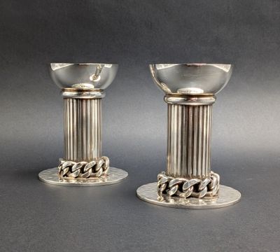 pair of silver plated candlesticks with chain handles
