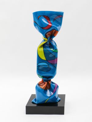 a blue vase sitting on top of a black base