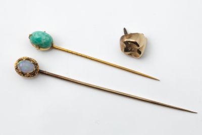 two gold - plated hair pins with opalite and opalite stones