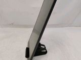 a tablet that is sitting on a stand on a table