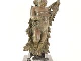statue of an angel holding a harp on a marble base