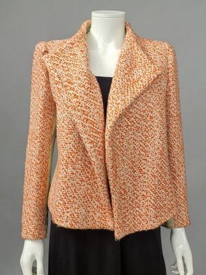 a woman ' s orange and black jacket on a mannequin mannequin mannequin mannequin mannequin mannequin mannequin mann