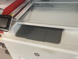 a printer that is sitting on top of a desk