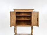 a wooden cabinet with a door open on a white background