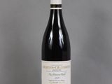 a bottle of wine that is sitting on a table